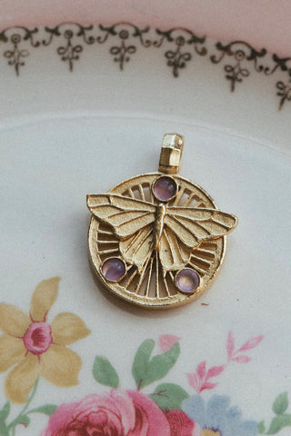 14kt gold butterfly pendant with amethyst gemstone	