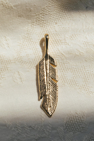 handcrafted gold feather pendant charm
