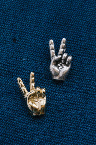 14kt gold and vintage silver peace hands pendants	