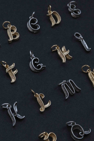 elegant gold and silver letter charms from the past	