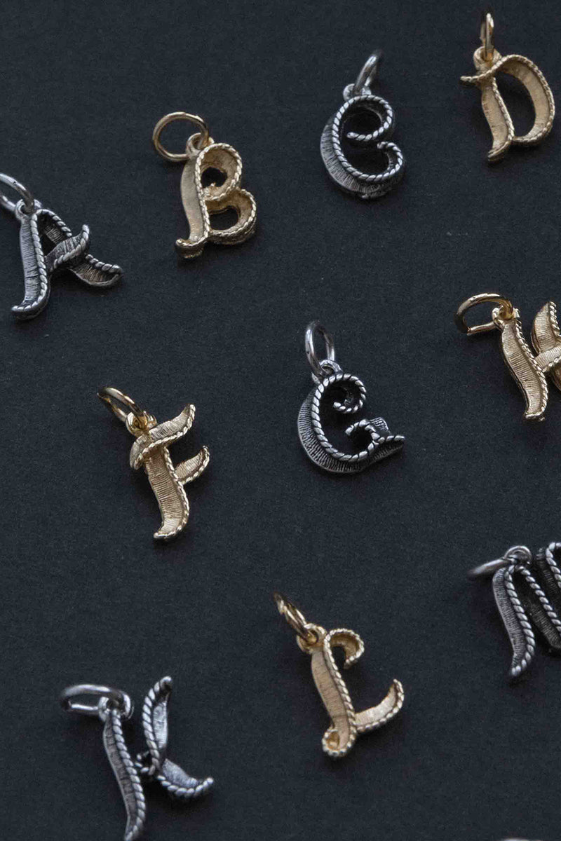 Letter W charm golden metal