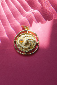 sun and wave pendant in vintage 14 karat gold