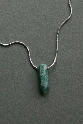 green aventurine gemstone on silver necklace