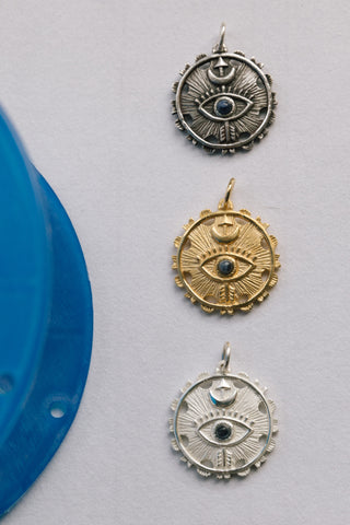 14kt gold sterling silver and antiqued silver eye of truth pendants	