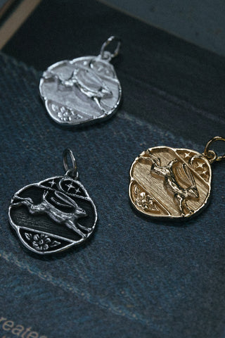 antiqued .925 sterling silver 999 fine silver and 14kt gold hare pendants	