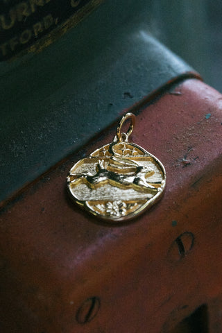 handcrafted 14kt gold look and leap hare pendant	